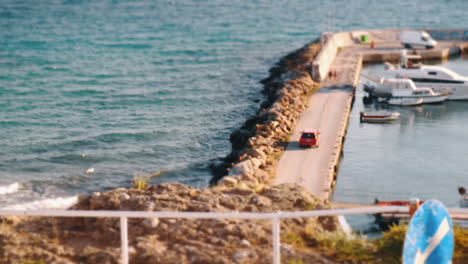 Timelapse-of-sea-waves-and-quay-with-boats