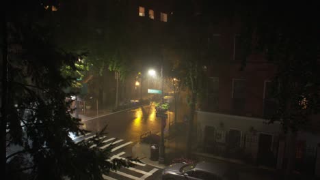 wide: downpour at night on beekman place, new york city.