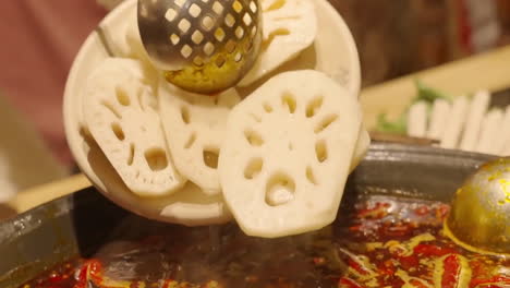 close up traditional chinese spicy hot pot style with a brass pot