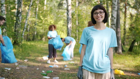 volunteers cleaning up a forest
