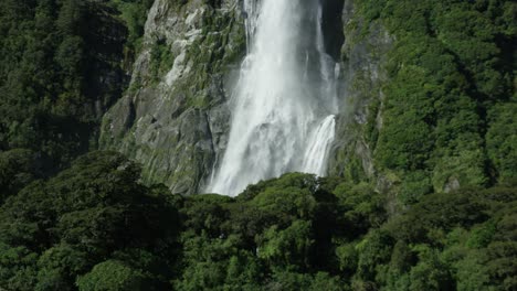 epic slow motion shot of waterfall in milford sound