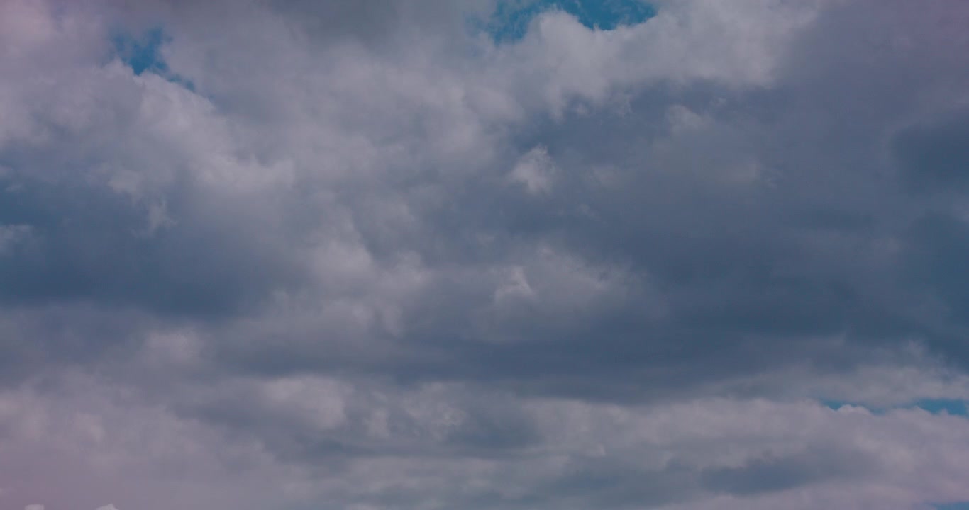 Dramatic Grey Clouds Drifting Across a Blue Sky