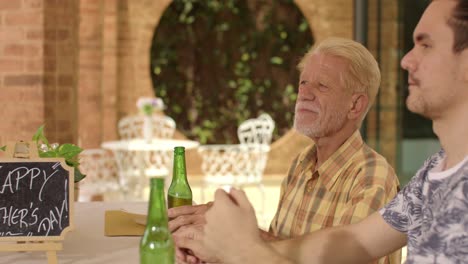 father and son celebrating father's day outdoors