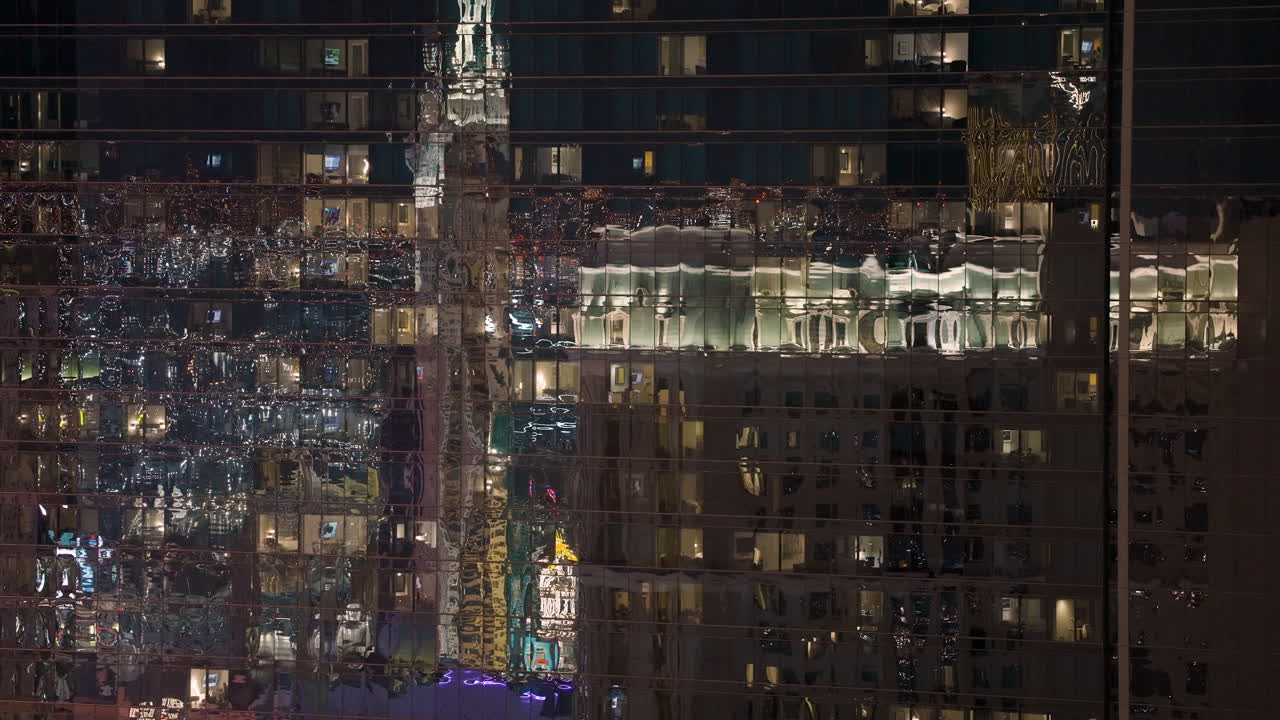 Nighttime Reflections on a Modern Building Facade