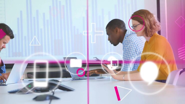 Team typing laptops, scrolling tablet, starting pink icons syncing devices over bar chart business