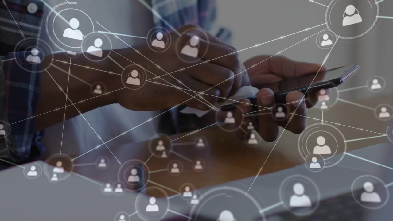 Mid-adult man tapping smartphone and initiating user-icon network, growing tech connections