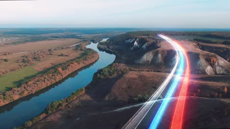 aerial view of a scenic river valley with a road