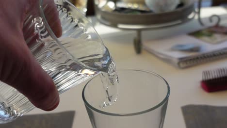 two glasses of water in slowmotion