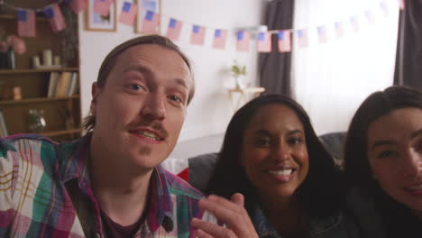 POV-Shot-Of-Friends-At-Home-Celebrating-With-Party-For-American-Independence-Day-4th-July-Taking-Selfie-On-Mobile-Phone