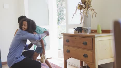 African-american-father-giving-snack-to-his-daughter-before-school