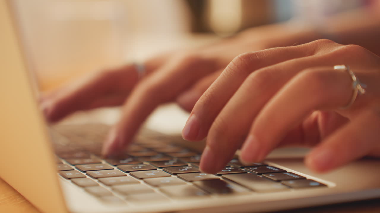 Calmly editing manuscript in tranquil night. Nighttime typing session with focused fingers on warm keyboard. Peaceful night setting as hands carefully edit and type manuscript at hotel bedside