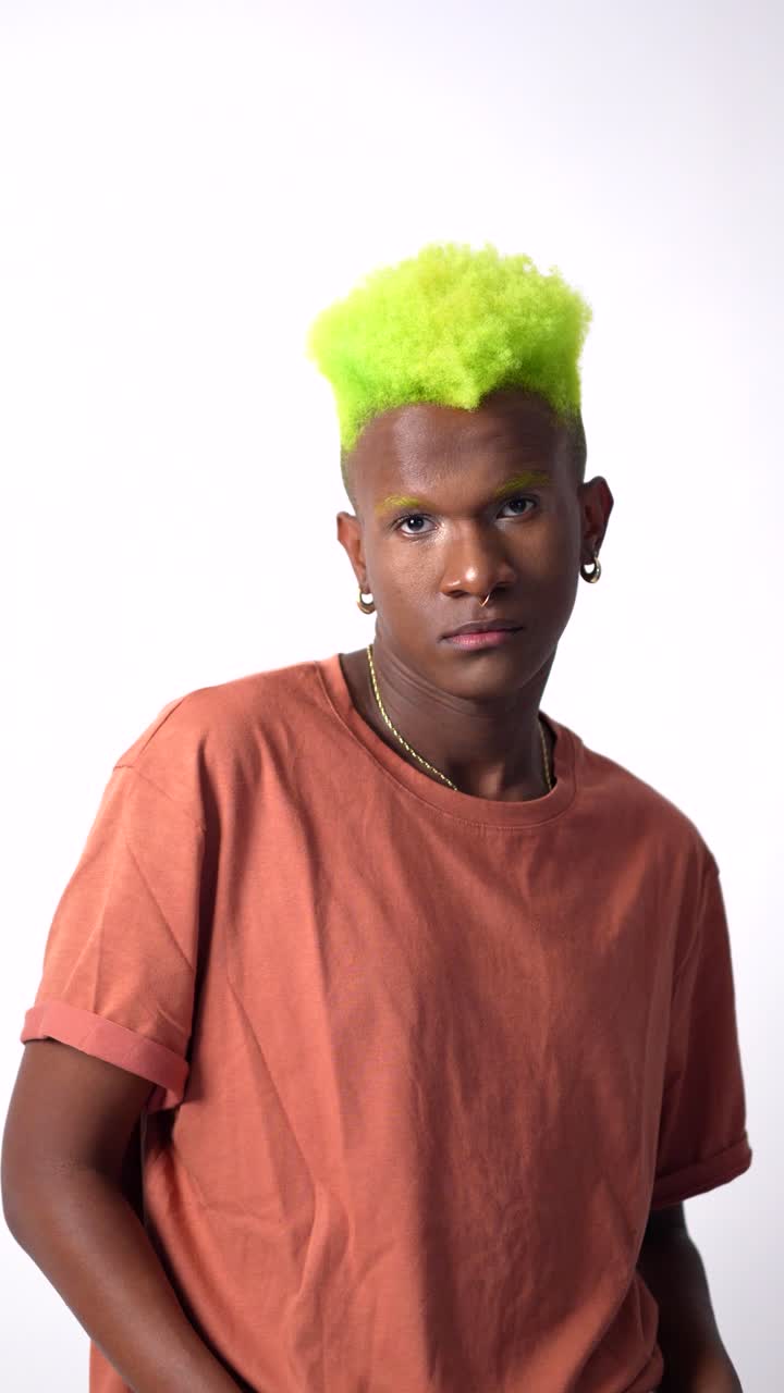 Portrait of a man with green hair