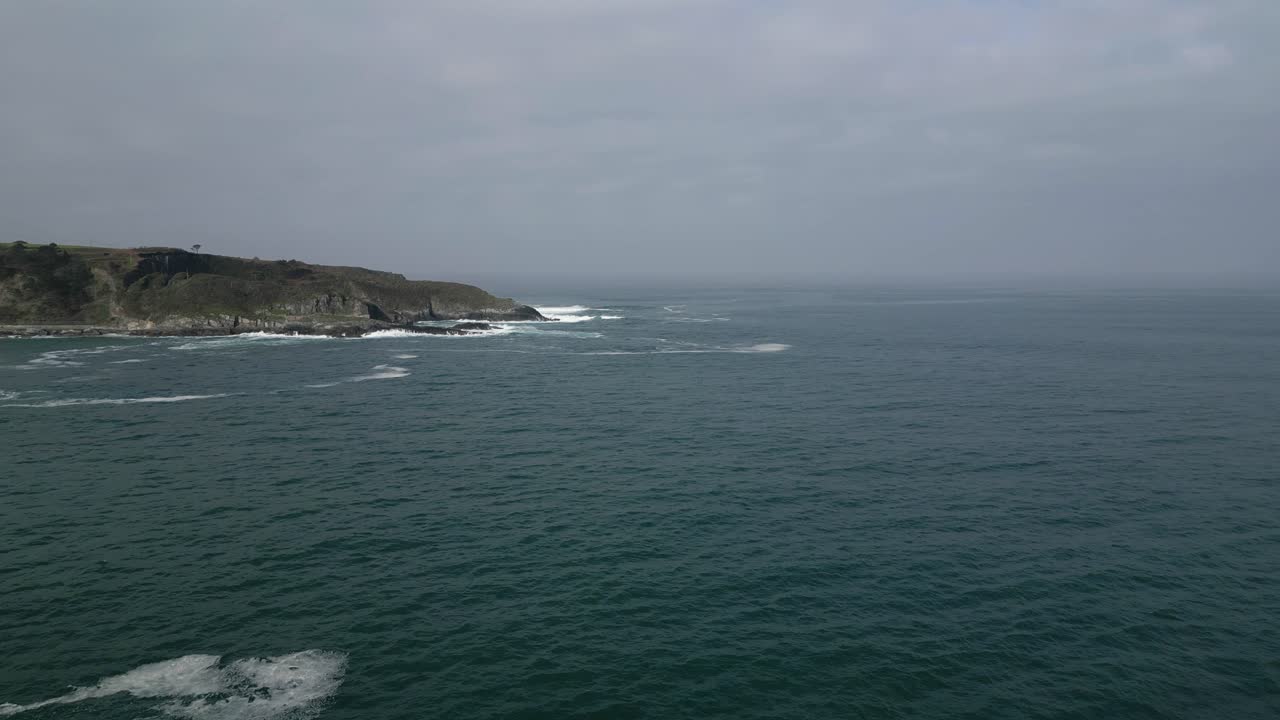Aerial drone shot of beautiful sea view under cloudy sky