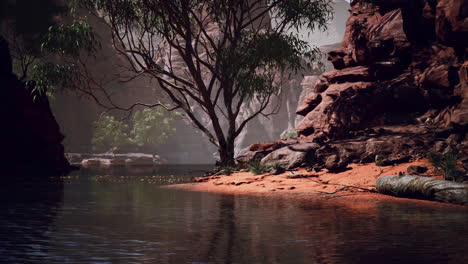 Reflection-in-Colorado-River-of-Butte-catching-days-last-rays,-in-Grand-Canyon.