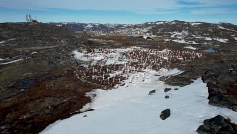 aerial crane over ilulissat cemetery landmark, icefjord visitor centre in greenland