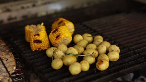 grilled corn and potatoes on the barbecue