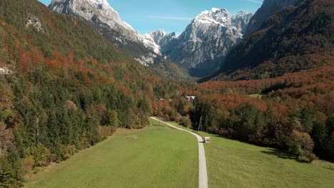 rising aerial green valley road forest mountains beautiful landscape blue sky day