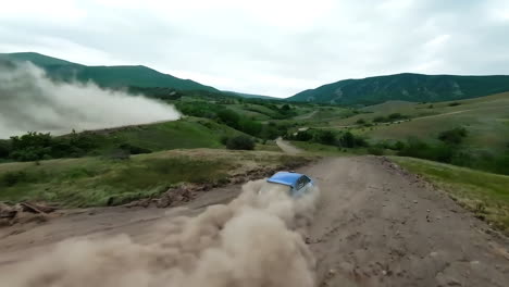 rally car racing through the mountains