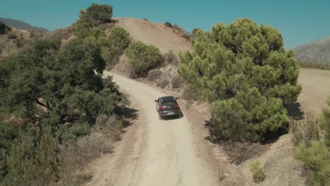 drone following car on the mountain path