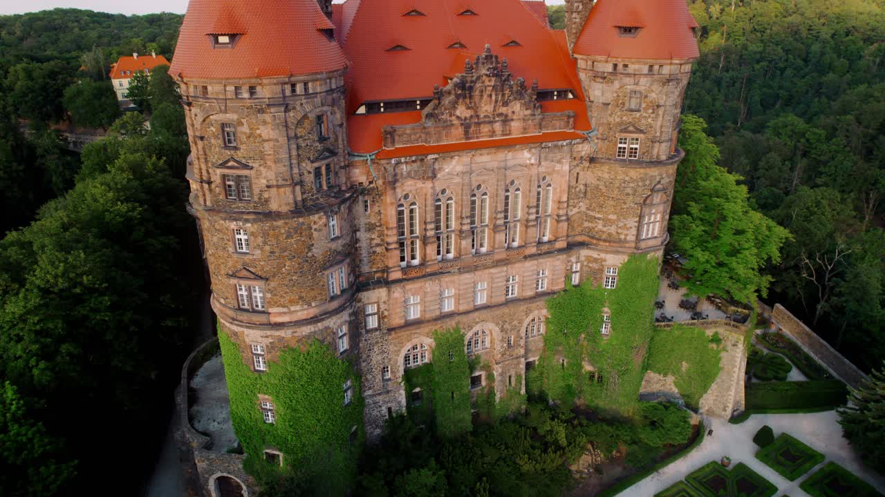 Aerial View of a Majestic Castle in a Lush Forest