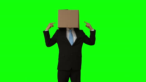 businessman standing with box over his head