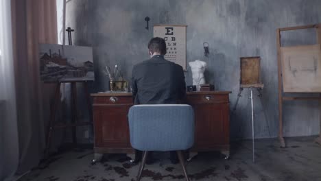 artist at work in a vintage studio