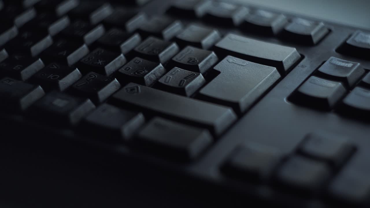 Close-up of a dark computer keyboard