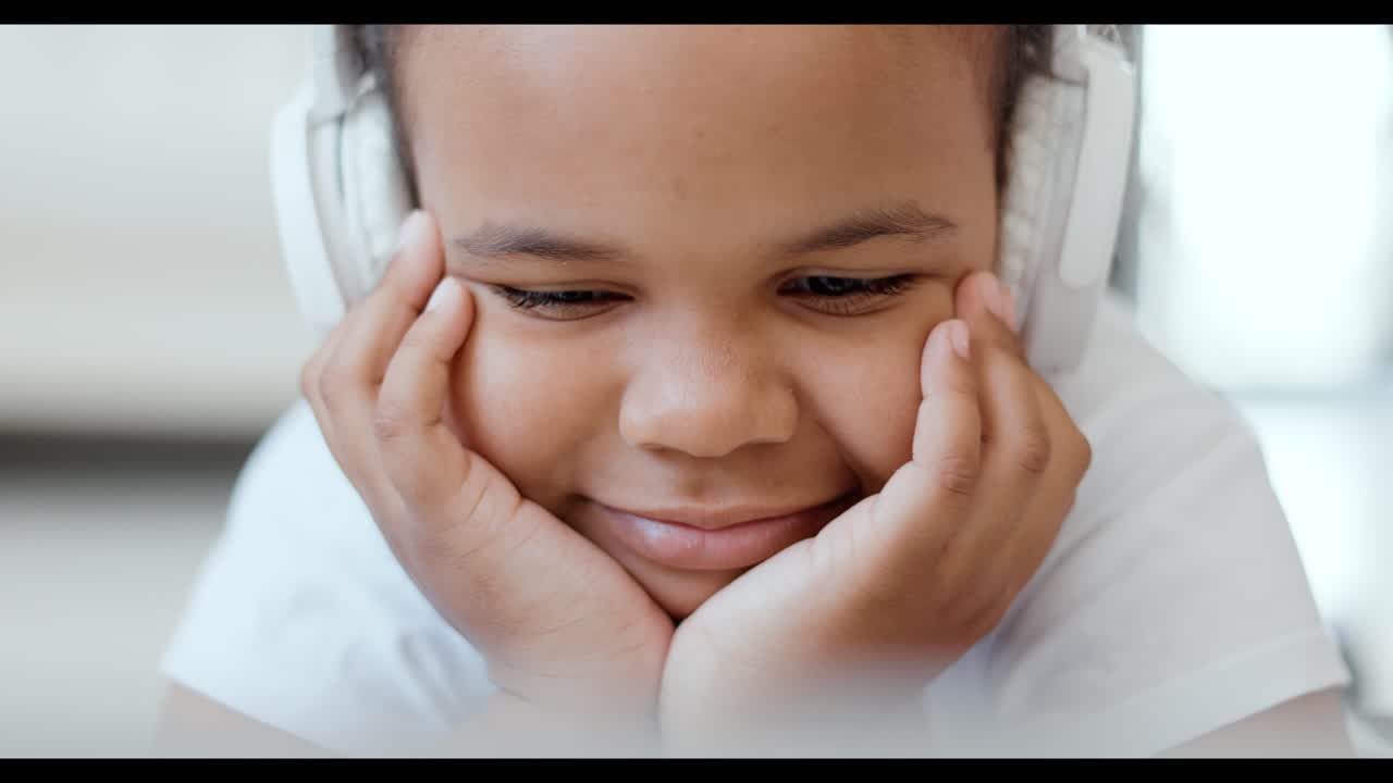 Girl Listening to Music and Looking at a Laptop