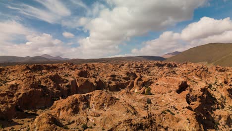 amazing view of valley of the rocks in the altiplano of bolivia near uyuni, south america. aerial ascending shot