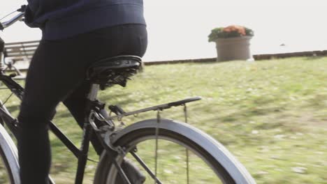 Follow-shot-tracking-a-cyclist-in-motion-on-a-bright-sunny-day