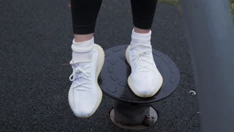 woman's feet on shaky platform balancing mobility exercise