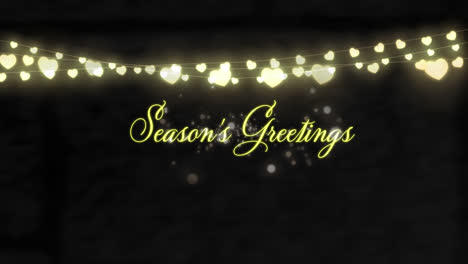 Animation-of-season's-greetings-text-and-christmas-fairy-lights-decoration-on-black-background