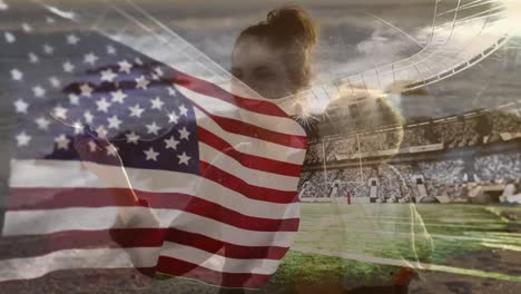 Animation-of-american-flag-and-stadium-over-caucasian-mother-blowing-bubbles-with-child