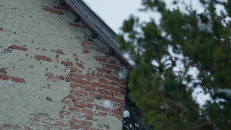 Slowmotion-snowballs-hiting-and-splashing-a-red-brick-stone-wall