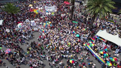 square full of diverce people, during the gay pride parade - aerial view