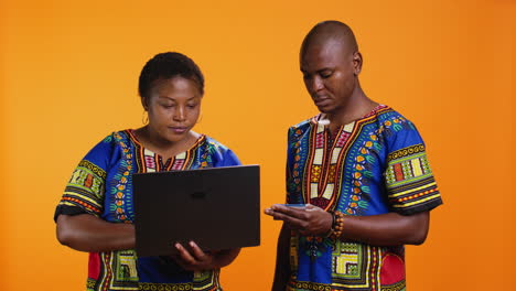 ethnic man and woman doing online shopping on website