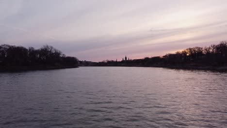 moving forwards over river towards church