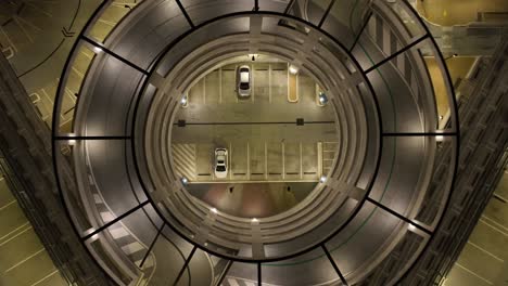 Drone-shot-of-multi-story-car-park-at-night-time