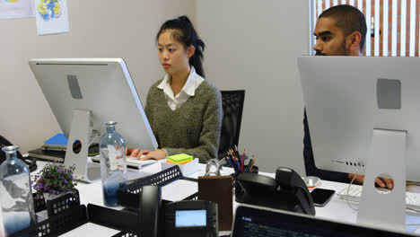 business executives interacting while using computer 4k