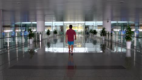 man goes to airport terminal building