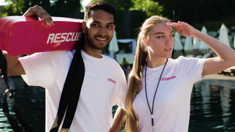 lifeguards talking by the pool