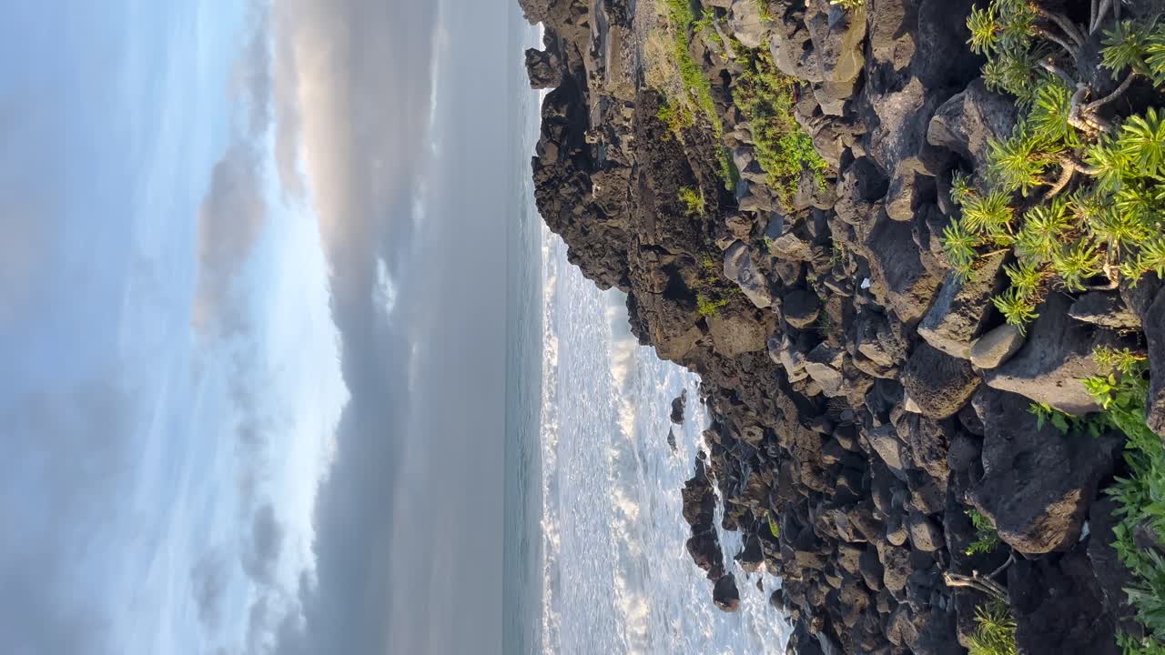 Azores islands Portugal rocky coast volcanic black color Atlantic Ocean waves coastline