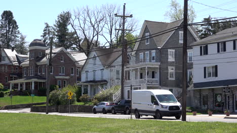 old homes and small businesses along a street in a small town