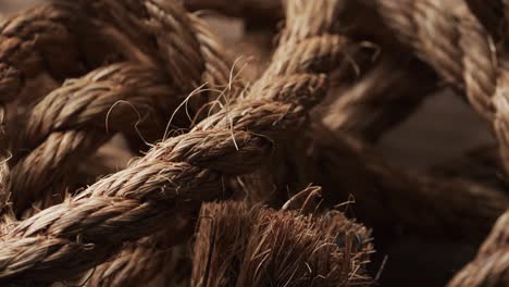 Micro-video-of-close-up-of-brown-string-with-copy-space