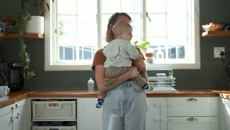 mother and baby in kitchen