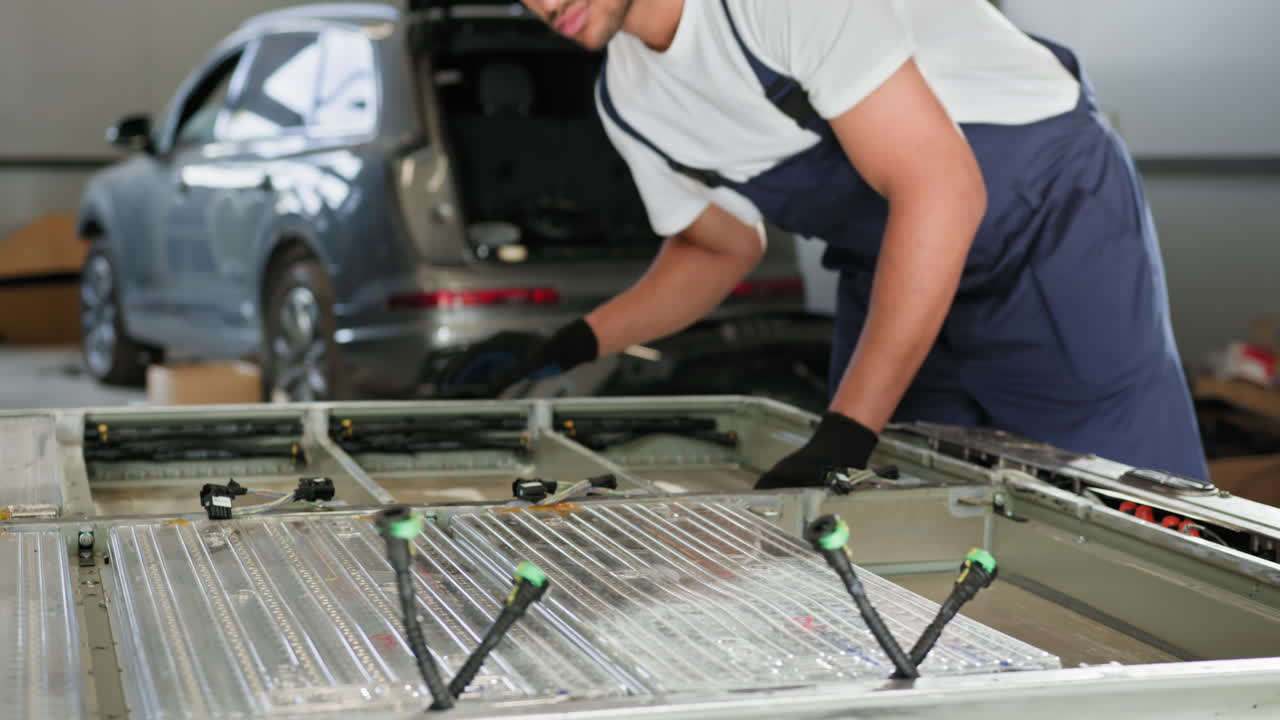 Automotive Technician Working on an Electric Vehicle Battery