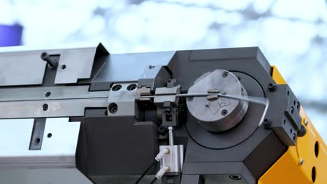 wire bending machine. cnc metal processing. automated metalworking machine.