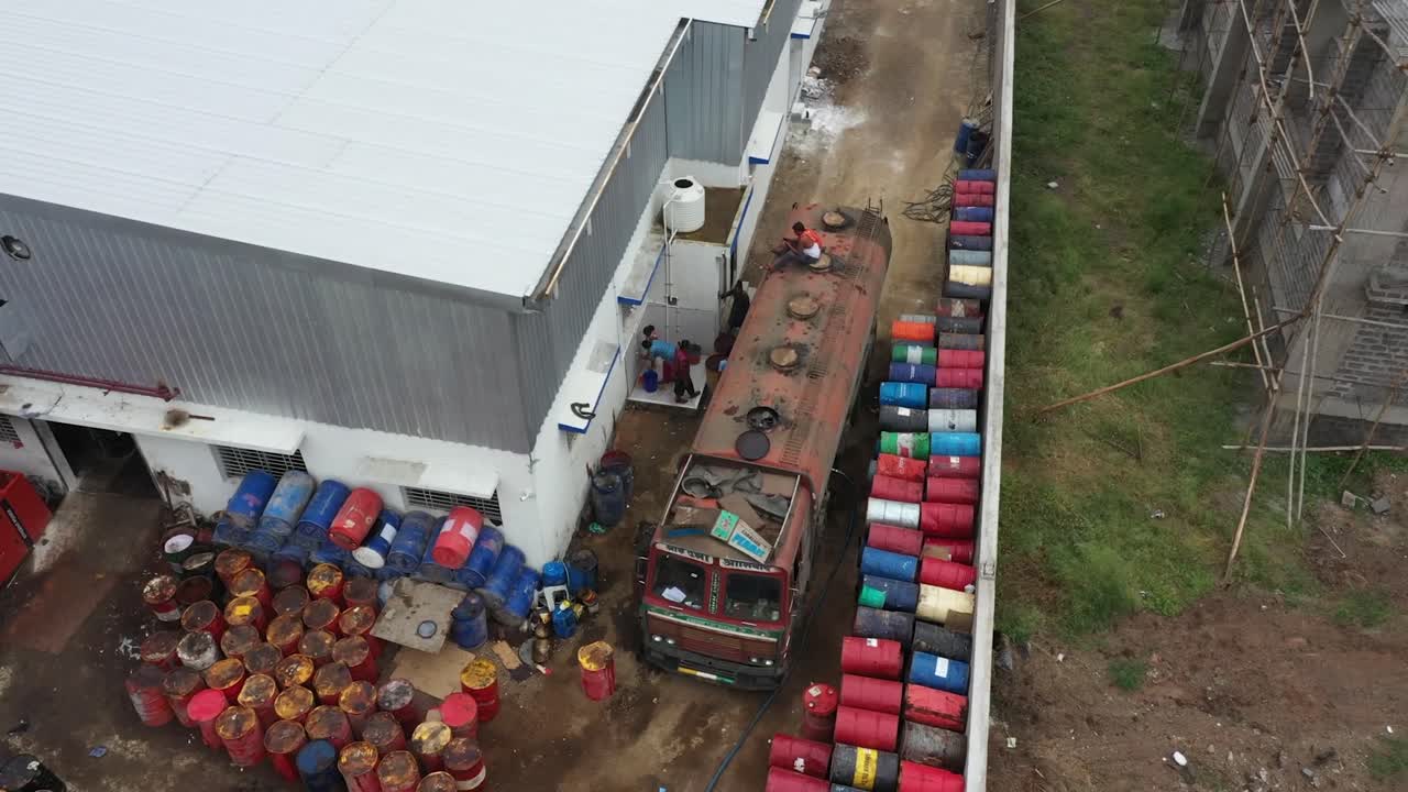 many man filling a petrol in tanker, industry 5.0