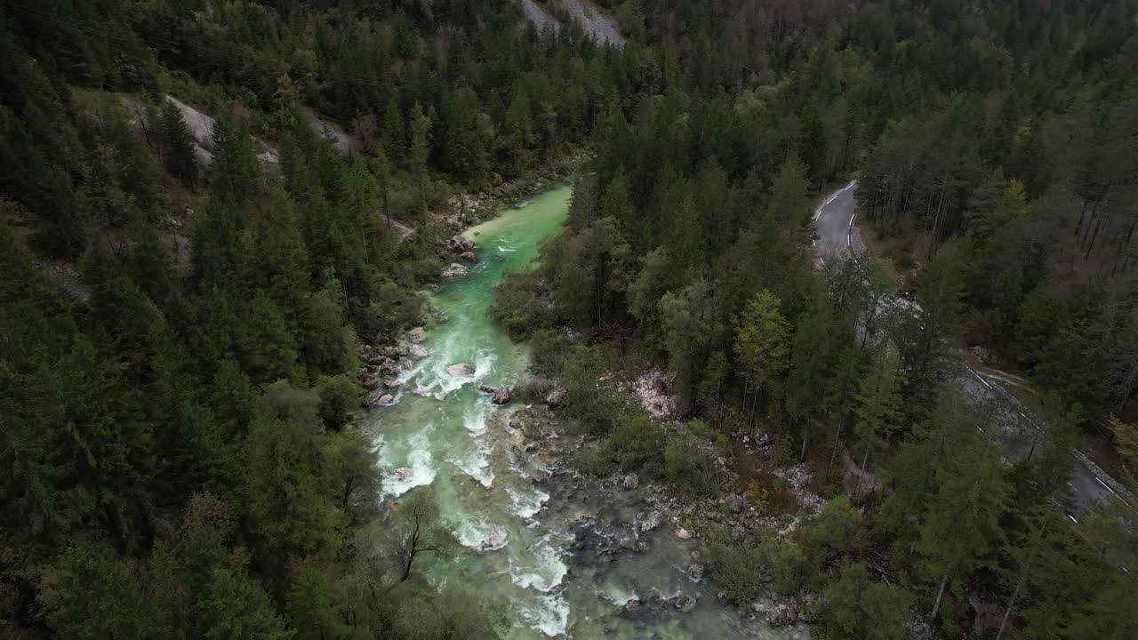 Aerial Dolly Shot of beautiful Soca river in Slovenia, Alpine landscape view and emerald waters flowing in nature valley