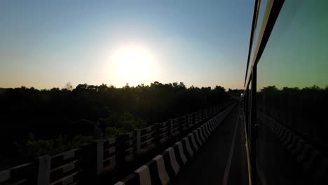 travelling mumbai to malvan wide view from bus window in evening